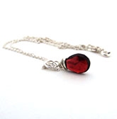 Red garnet pendant wire wrapped with sterling silver
